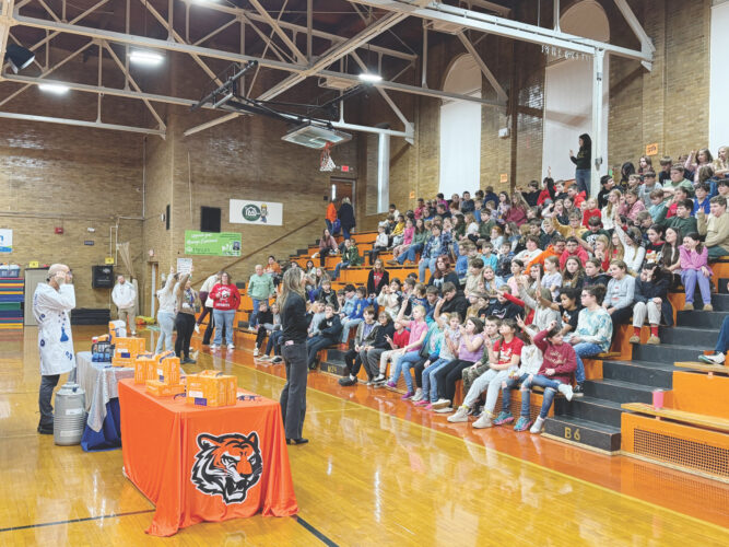 Science kits are donated along with a demonstration by COSI at Marietta Elementary School